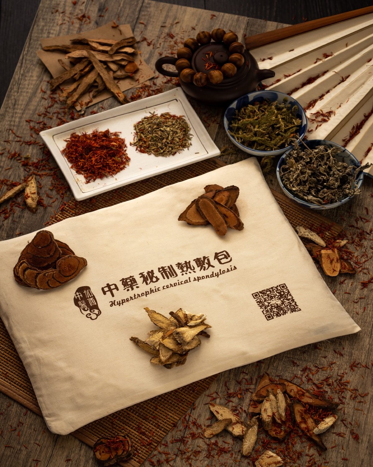 Editorial flat-lay of Chinese herbs and traditional warm pack — Canadian Western TCM heritage